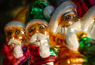 close up shot of three santa claus figurines