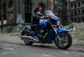 a woman riding a big motorcycle