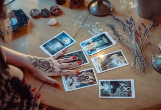 assorted tarot cards on table